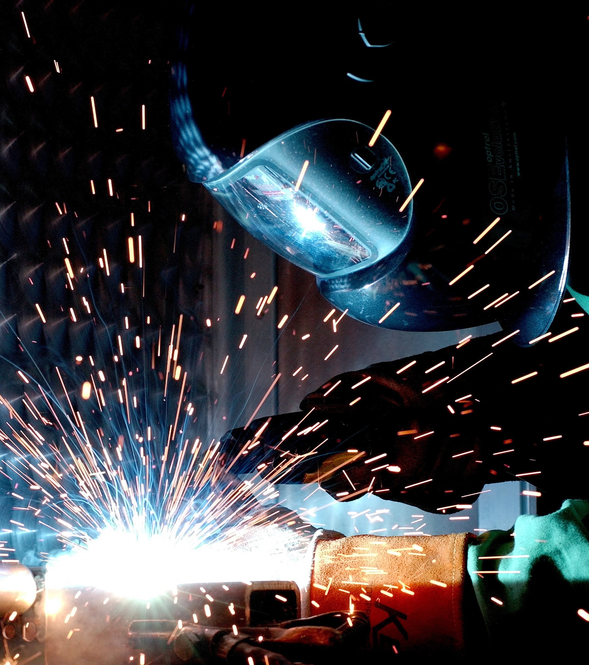 Industrial metalworking with bright welding sparks